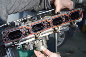 What is a car's inlet (intake) manifold?